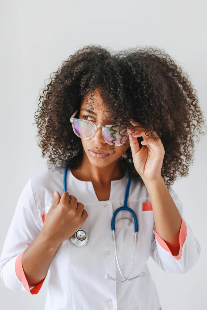 Close-up of a female doctor adjusting her glasses, exuding confidence and professionalism.